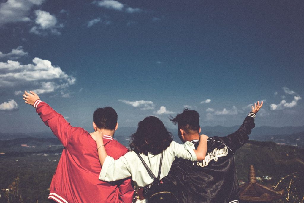 Staying on the Path of Love: A joyful moment with friends overlooking a scenic landscape in Gia Lai, Vietnam.